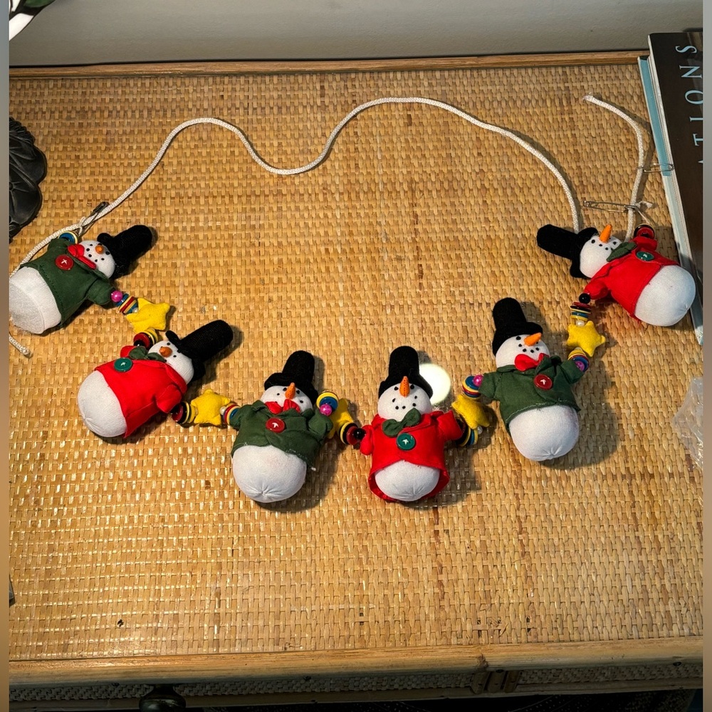 Handmade snowman garland measures 27.5”
